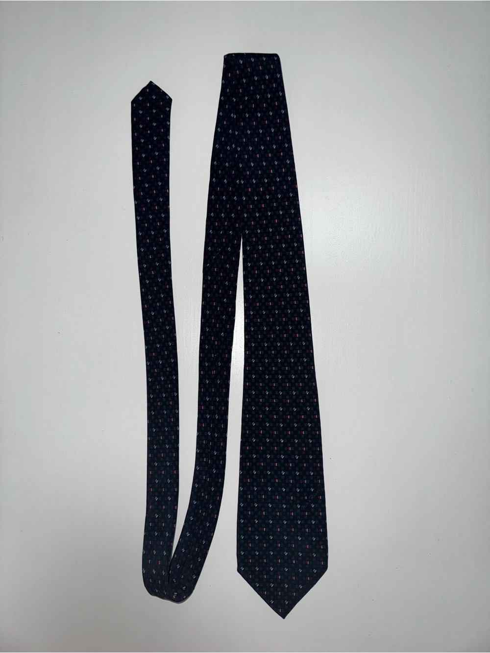 Nina Ricci Navy Tie with Subtle Pink Dot Pattern